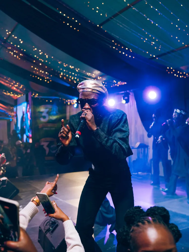 Kodong Klan performer singing to fans at the front row.